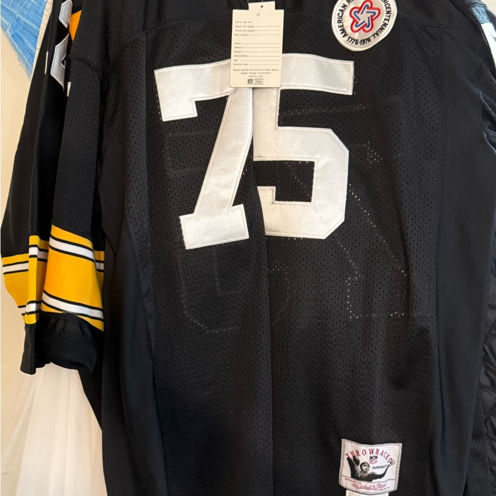 Black Jersey with Number 75 and Yellow Accents